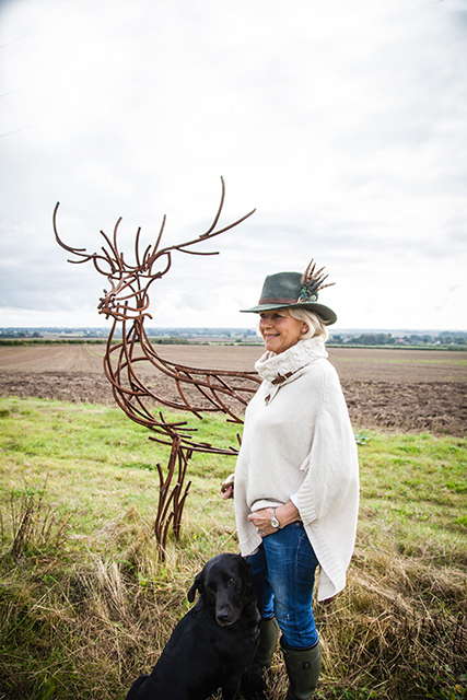 country fedora, lady in field wearing fedora with dog